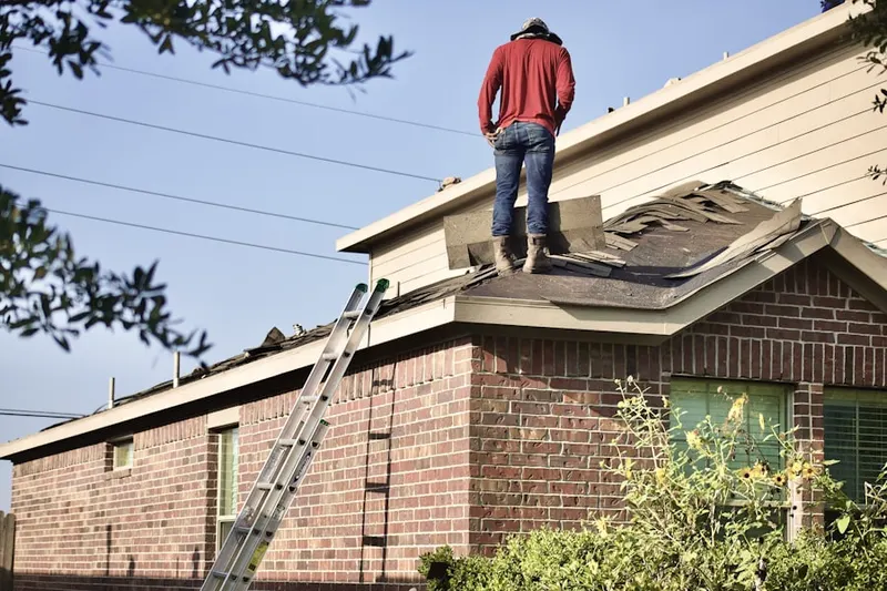 Professional roofer working on a residential roof in Naperville
